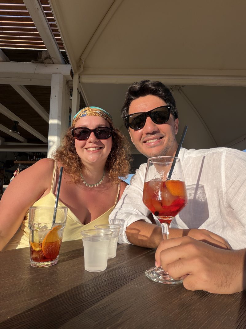 Benedetta and Batuhan with a spritz by the sea
